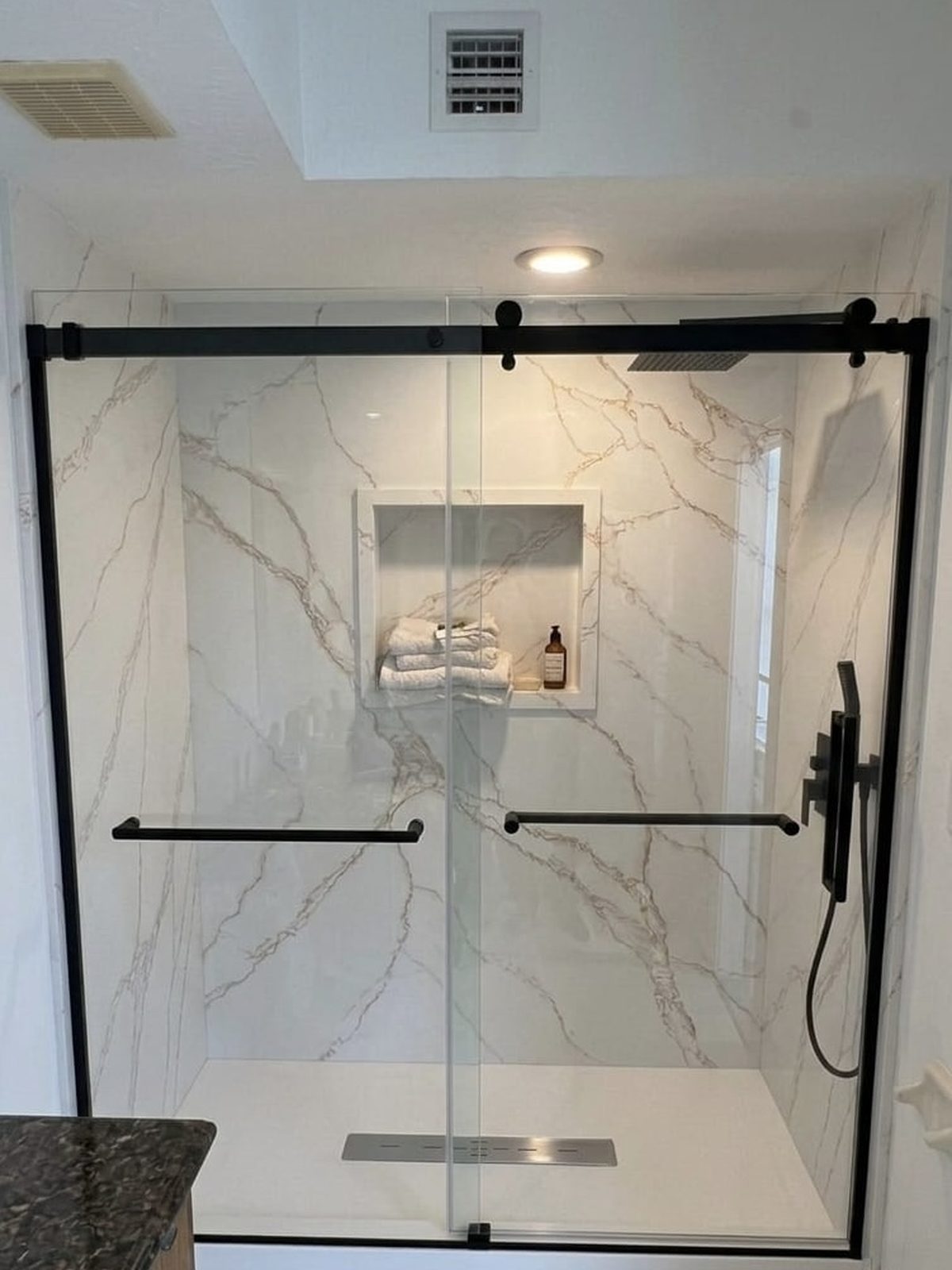 Sliding glass shower, solid surface walls